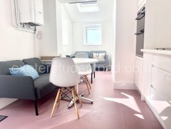 Kitchen looking to lounge area